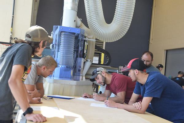 Engineering students working at a table together